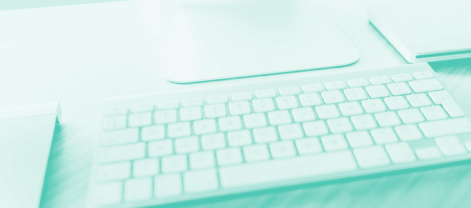 Computer keyboard and mouse highlighting the use of dashes over spaces and underscores for file naming and SEO optimization