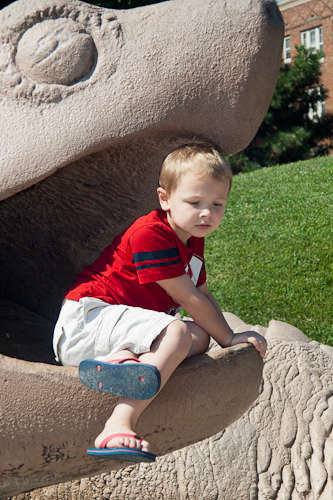 Boy on a statue shot with a manual focus lens.